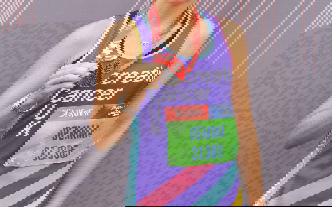 Gemma Antcliffe holding a medal for the great north run