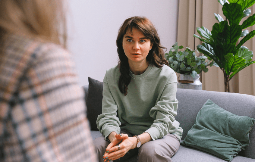 woman sitting across from a counsellor
